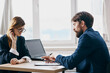 © SHOTPRIME STUDIO - colleagues in the office in front of a laptop career network technologies