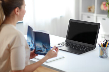 Canvas Print - distant education, school and people concept - female math teacher laptop computer and book having online class at home