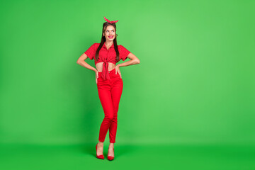 Canvas Print - Full length body size photo young woman wearing red outfit smiling looking copyspace isolated bright green color background