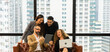 © Patcharanan - Coworkers team working new startup project at modern office. Analyze business people documents, using touch tablet and laptop. Business meeting concept.