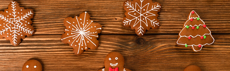 Poster - top view of gingerbread cookies on wooden surface, banner