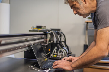 Engineer technician electrician inspect system with laptop computer. Electric installation