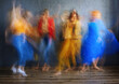 © VISTA by Westend61 - Women in multi colored dress dancing on floor in studio