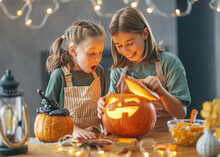 Girls With Carving Pumpkin