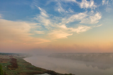 Wall Mural - morning fog over the river floodplain in autumn