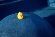 © VISTA by Westend61 - Yellow rubber duck on blue structure at skateboard park
