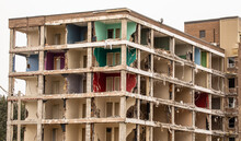 The Colorful Interior Walls Of An Old Apartment Building Being Demolished
