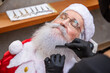 © StockImageBrasil - Santa Claus shaving in barbershop. Getting ready for Christmas. Beautifying for the holidays. Bearded. Cuting..