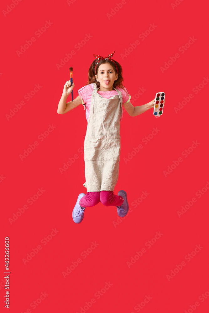 Jumping little painter on color background