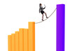 © Elnur - Businesswoman walking on tight rope between bar chart