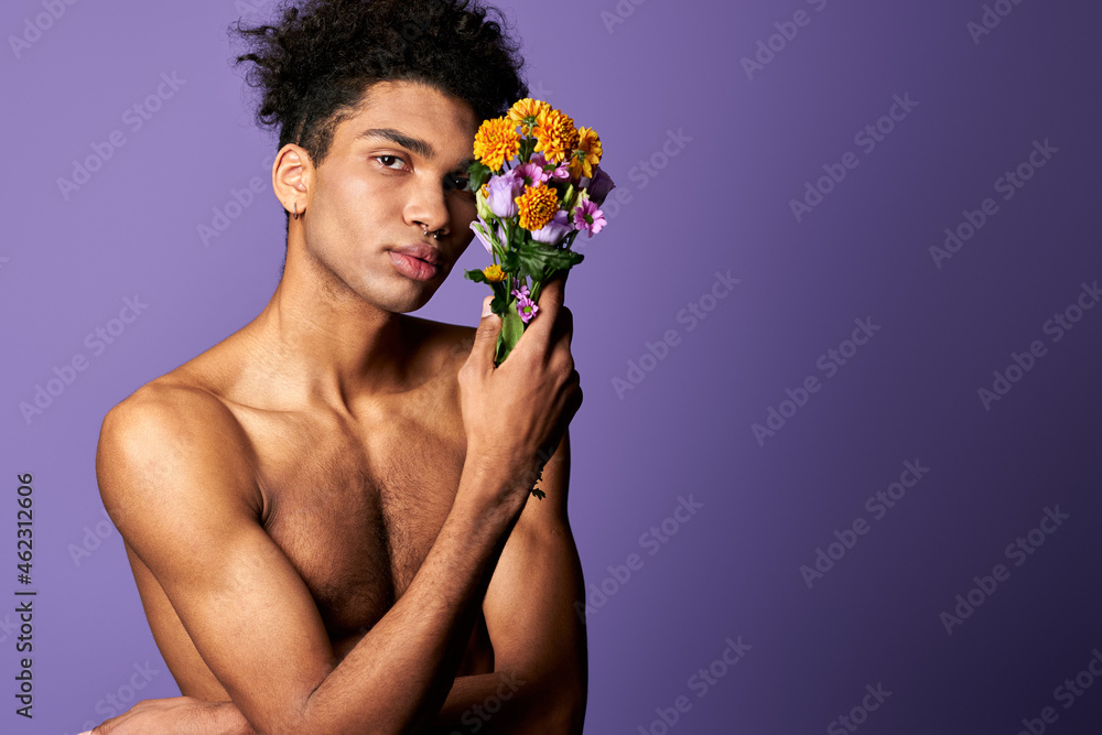 Nacked hispanic male with flowers in