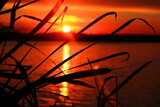 Fototapeta  - Zachód słońca nad jeziorem. Sunset on the lake.