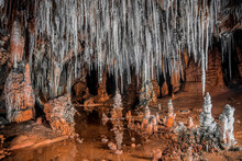 Closeup Shot Of A Cave With Stone Crystals Hanging From The Ceiling