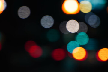 Beautiful sparkling bokeh in a dark blur background at night.