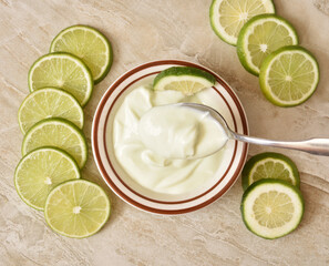 Wall Mural - Bowl of lime yogurt, overhead view