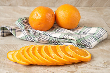 Poster - Fresh sliced orange on a kitchen counter