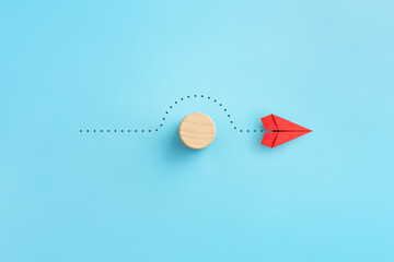 Wall Mural - Business for solution concept. red paper plane with wooden block