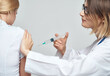 © SHOTPRIME STUDIO - nurse syringe in hand treatment isolated background
