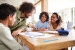 © Southworks - Boys drawing at kitchen table with parents