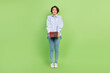© deagreez - Full body photo of young woman happy positive smile hold book education isolated over green color background