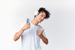 © SHOTPRIME STUDIO - curly-haired guy in white t-shirt with headphones music technology entertainment