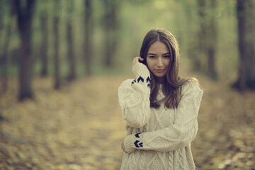 Wall Mural - sad girl in autumn park, stress loneliness young person female