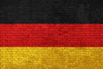 Wall Mural - wall of bricks painted with the national flag of Germany. black, yellow and red. 3d background. Concept of social barriers of immigration, divisions, and political conflicts in Germany.