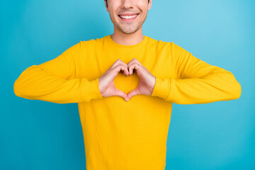 Sticker - Cropped photo of young guy hands heart wear yellow shirt isolated on blue color background