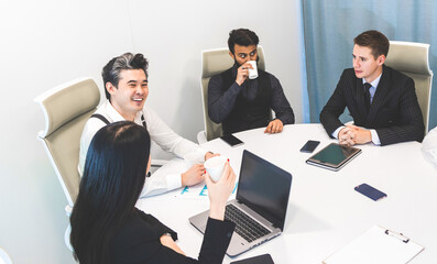 Wall Mural - top view Group of young business people working and communicating while sitting at the office desk together with colleagues sitting. business meeting