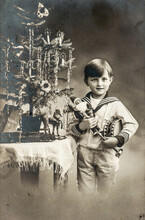 Christmas Tree Antique Toys. Happy Child With Gifts Vintage Picture