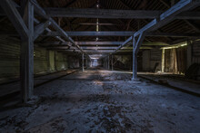 Inside Dark Abandoned Ruined Wooden Decaying Hangar With Rotting Columns