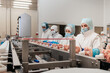 Automated production line with packaging and cutting of meat in modern food factory.Meat processing equipment.