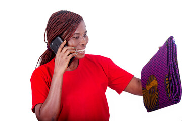 beautiful smiling woman talking on mobile phone while holding traditional loincloth.