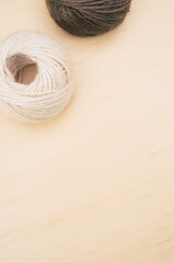 Canvas Print - shot of rough cotton decoration yarns on a bright wooden background