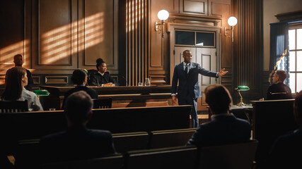 Wall Mural - Court of Law Trial in Session: Portrait of Charismatic Male Public Defender Making Touching, Passionate Speech to Judge and Jury. Attorney Lawyer Protecting Client, Presenting Case.