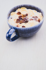 Canvas Print - Tasty breakfast with milk raisin and cereal in a bowl