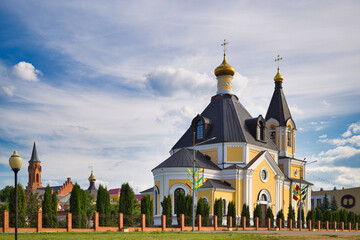 Wall Mural - Rechitsa, BELARUS - OCTOBER 12, 2021: Orthodox church against the blue sky