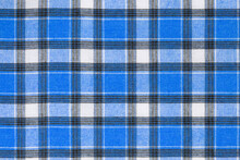 Blue White Tartan Texture Background. Shirt Fabric With A Checkered Pattern. Factory Material