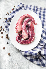 octopus food in a plate seafood second course fresh ready to eat meal snack on the table copy space food background rustic. top view keto or paleo vegetarian food no meat pescetarian diet