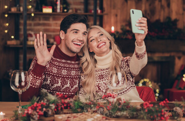 Sticker - Portrait of two beautiful handsome cheerful spouses spending festal time day eve fairy evening taking selfie waving greetings indoors