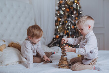 Cheerful Cute Children Boys Opening Gifts Under Christmas Tree.