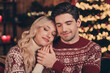 © deagreez - Photo of charming dreamy husband wife dressed pullovers celebrating noel closed eyes hugging holding hands arms indoors room home house