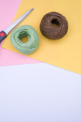 Poster - decoration yarn felt sheet and scissors on a bright wooden background