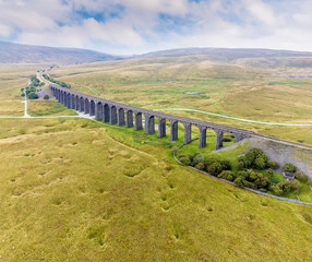 Wall Mural - An aerial view of the Ribblehead Viaduct, Yorkshire, UK on a summers day