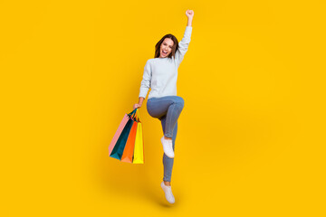 Canvas Print - Full length photo of brown haired stylish woman jump winner sale hold bag shopper isolated on yellow color background