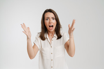 Wall Mural - Young european woman gesturing and screaming at camera