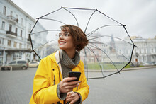 Girl In Yellow Raincoat With Transparent Umbrella