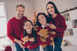 © deagreez - Photo of cheerful family good mood hug enjoy winter holiday together wear sweater xmas spirit guy indoors
