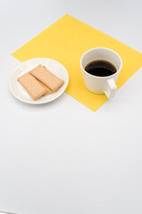 Sticker - cup of black coffee and light crisp cookies in a white plate