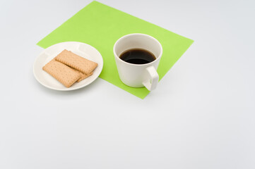 Sticker - cup of black coffee and light crisp cookies in a white plate